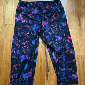 Zella crop leggings. XS. Black with pink and purple floral like pattern.
